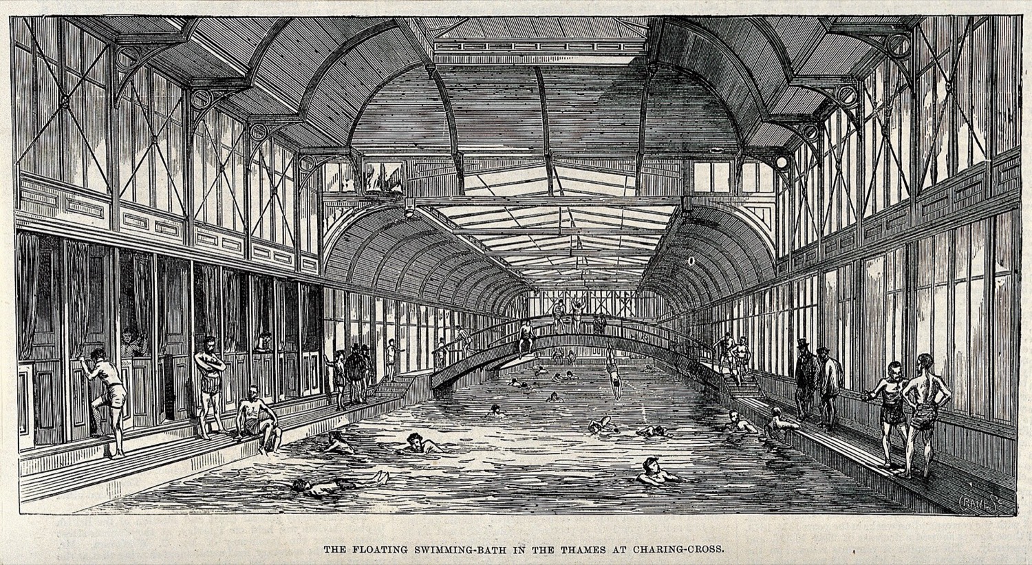 Engraving of the interior of a floating tank on the Thames, with about twenty swimmers in the water under iron trusses