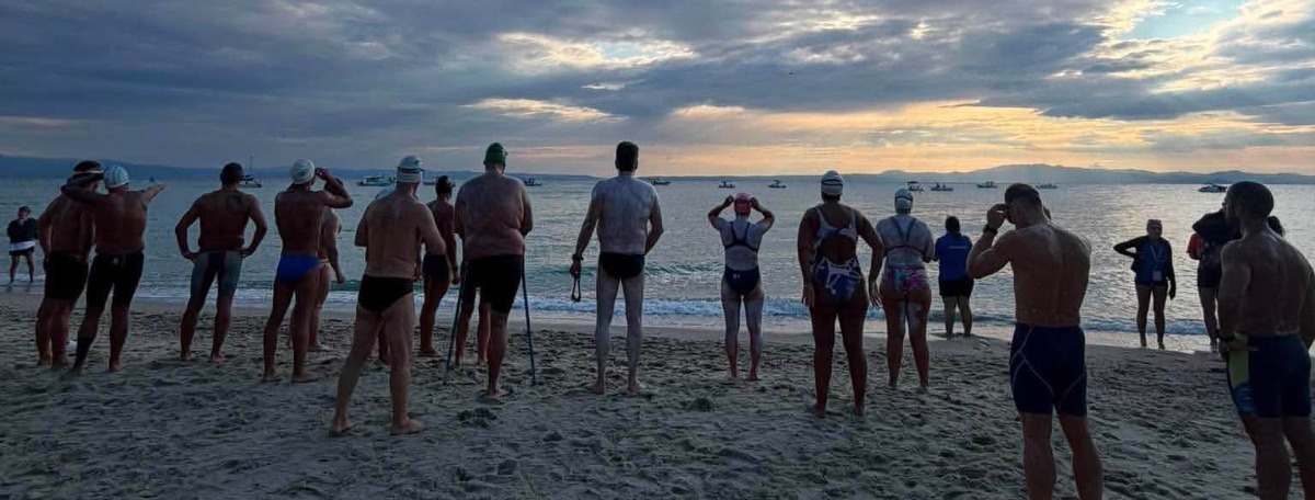 Participants on the beach before the start