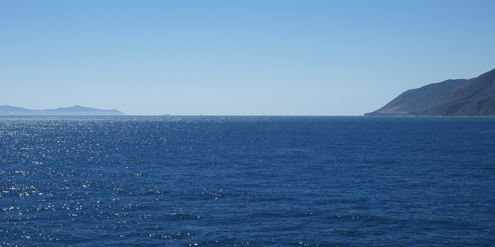 Cook Strait seen from the north: Cape Terawhiti on the right, Arapaoa Island on the left.