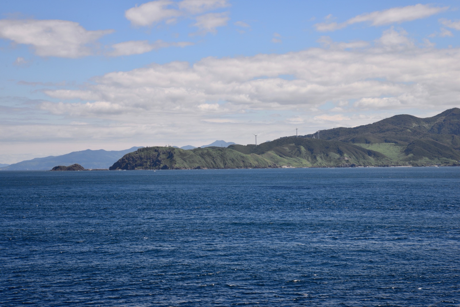 Cape Tappi, the north-western tip of Honshu, seen from the sea.